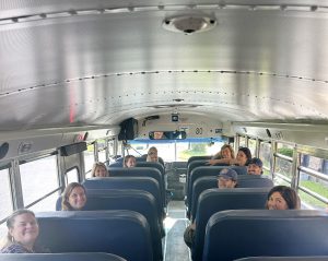 teachers take a ride on a school bus