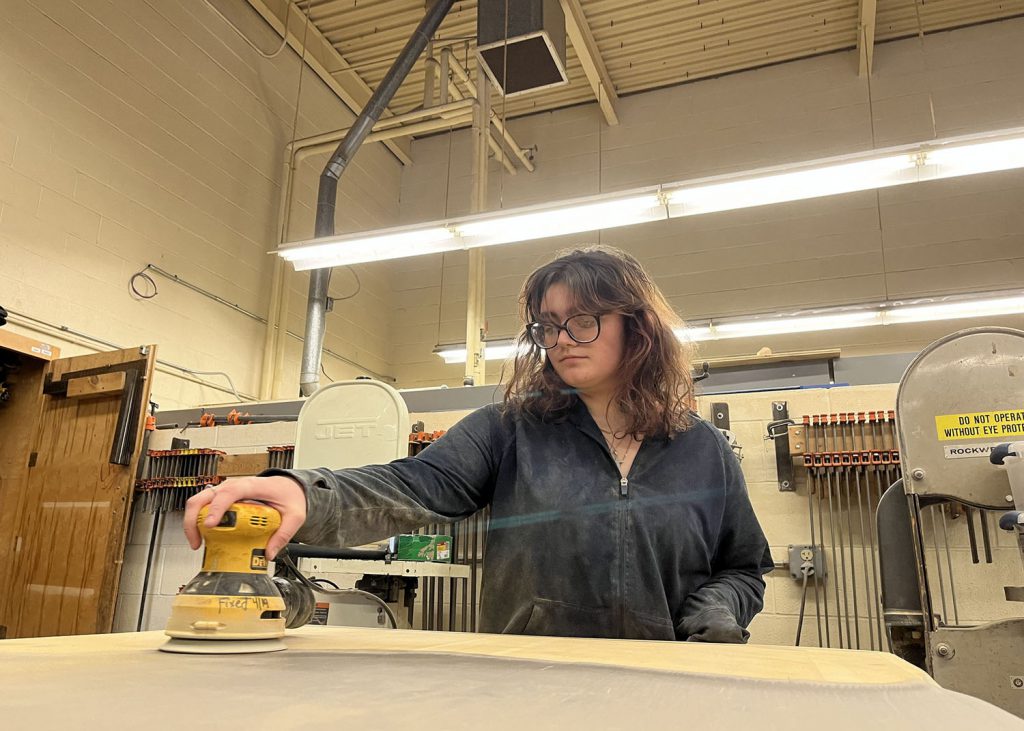 girl working with a sander