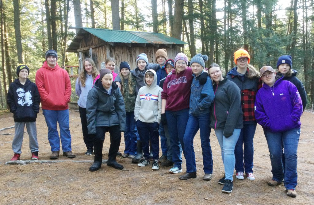 group photos of SSCS students outdoors at camp