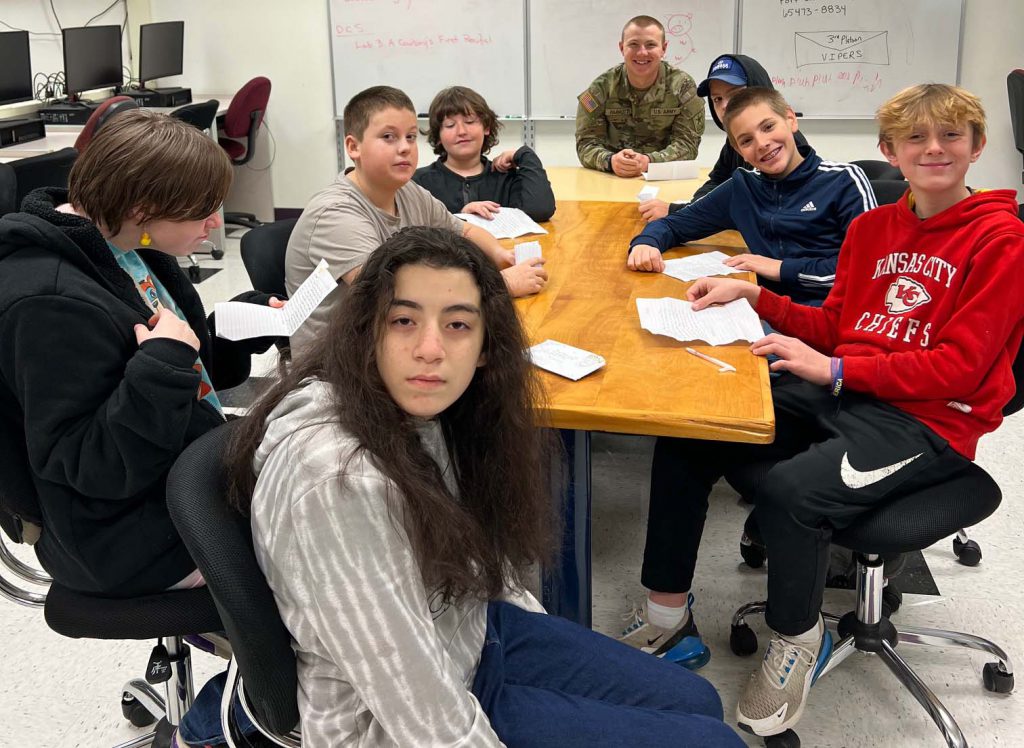 army guy visits with 7th graders in class