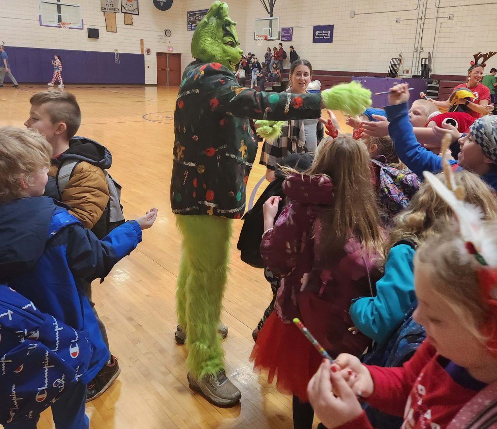 the Grinch passes out candy canes