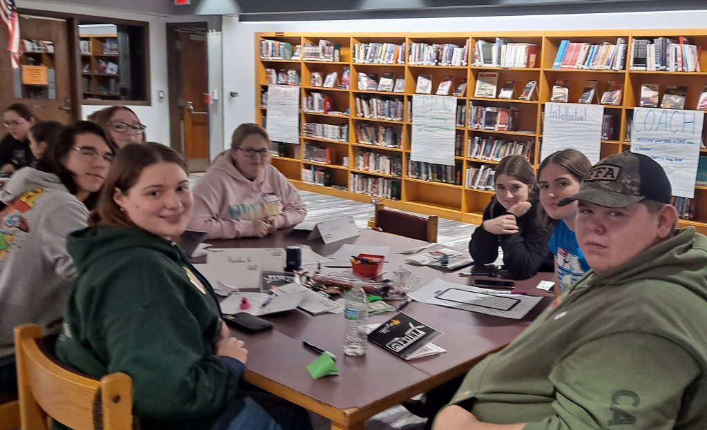 FFA officers work together at a table