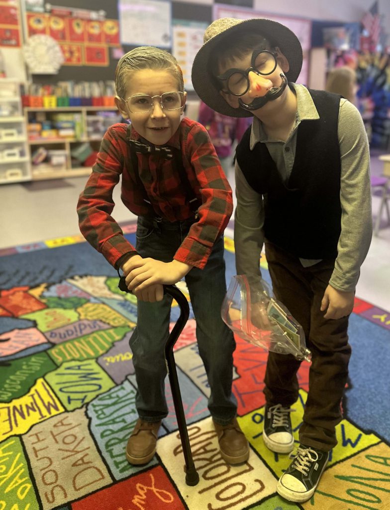 Two children dressed as old men