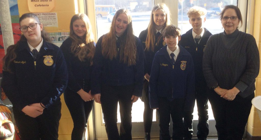 Group of SSCS student and their advisor in their FFA uniforms