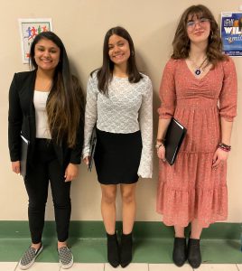 three female high school choral members