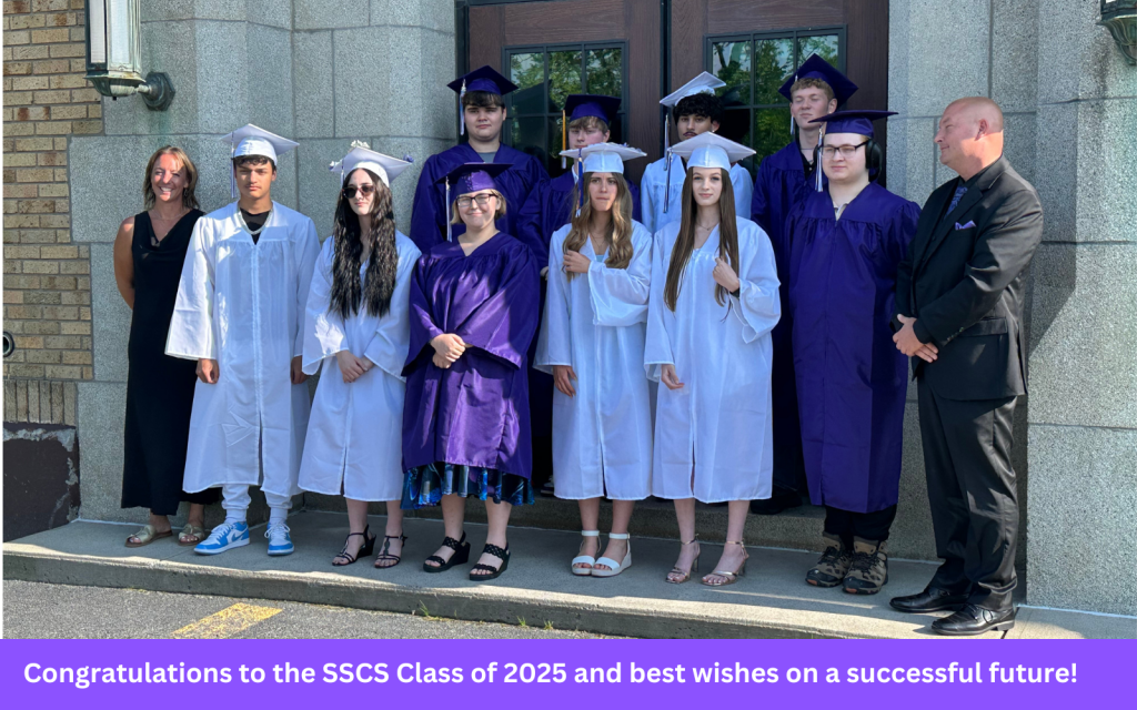 Class of 2025 group photo outside of school