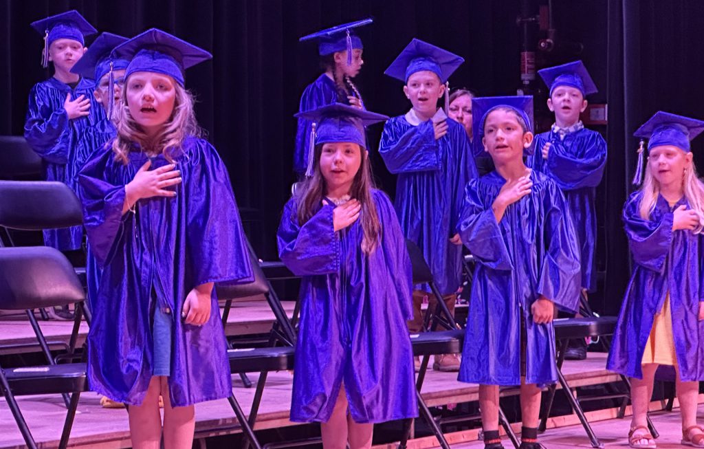 Kindergarten graduates on stage