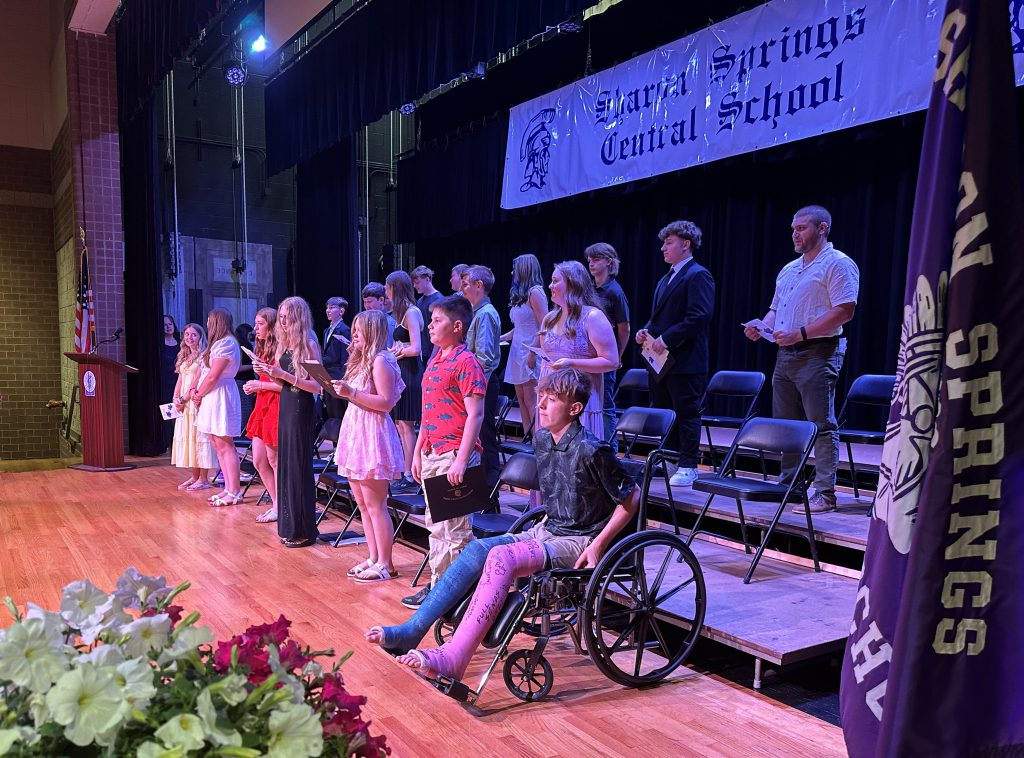 group of graduates on stage