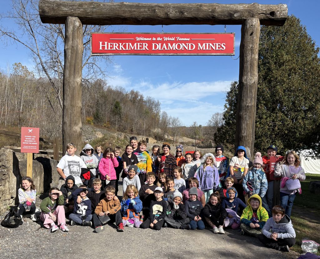 group of students in front of the Herkimer Diamond Mine sign