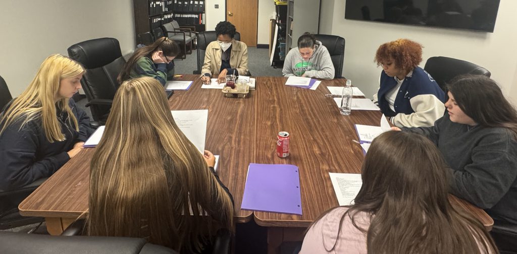Students work with a visiting poet