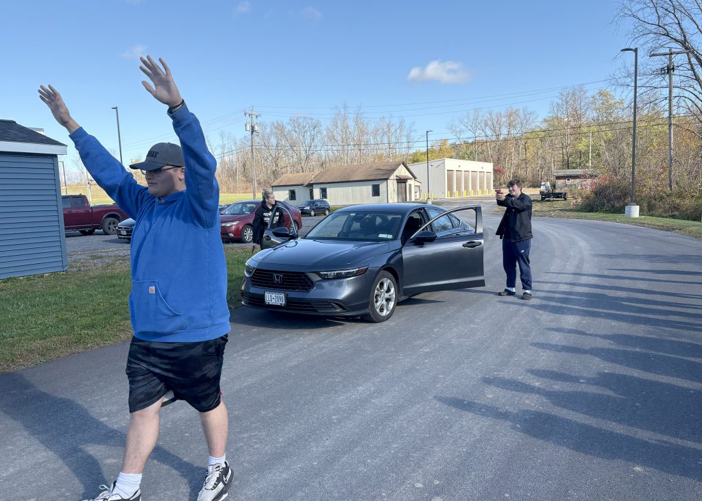 students act out an arrest scenario in Criminal Justice program