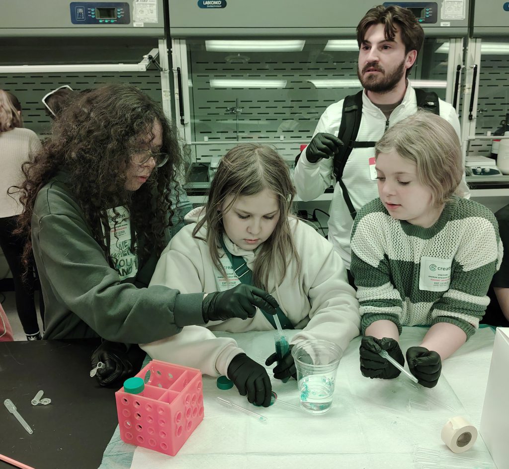 girls do hands on science experiments