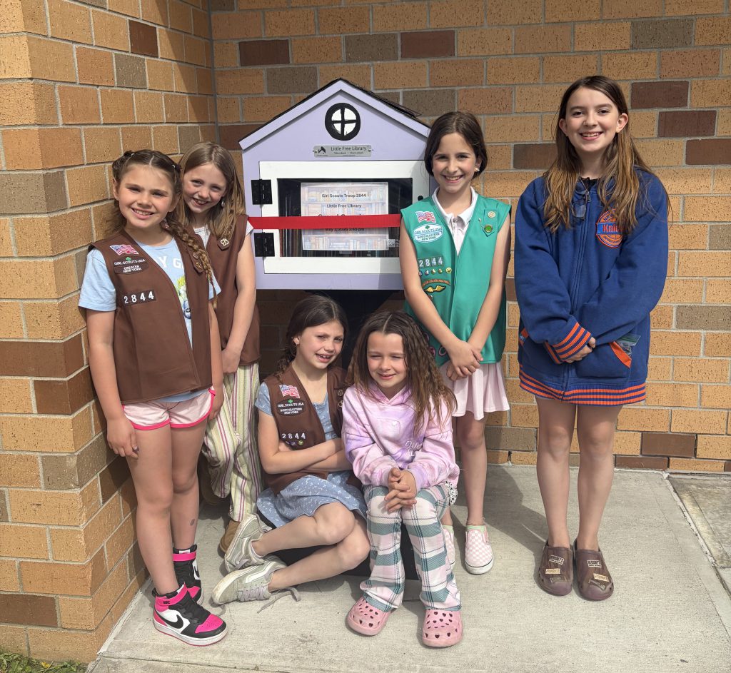 girls scout with Little Free Library