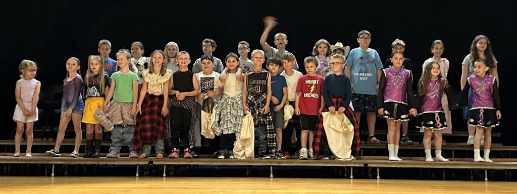 Talent Show performers take a bow on stage