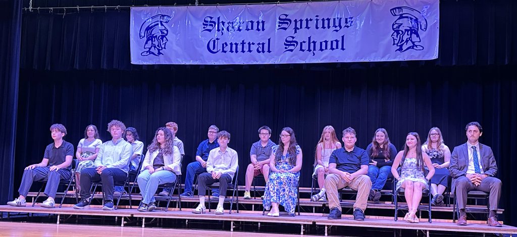 group of 8th grade graduates on stage